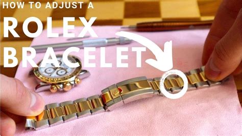 adjust rolex watch band.